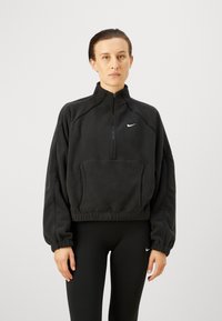 Pullover in pile nero con colletto alto, zip frontale a metà e tasca frontale. Caratterizzato da polsini elastici e logo ricamato sul petto.