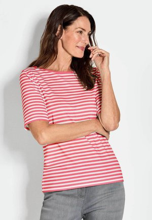 Rood en wit gestreepte t-shirt met korte mouwen, ronde halslijn en een relaxte fit. Draagt met grijze jeans. Zachte katoen materiaal.