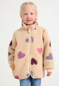 Beige fleece jacket with a high collar, featuring various colorful heart patterns in pink, purple, and red, with a front zipper.