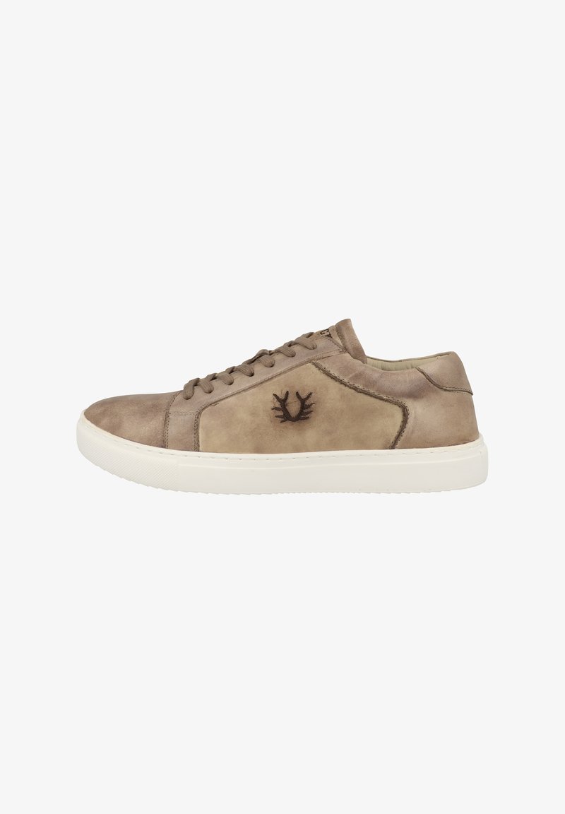 Beige suede sneaker with a white rubber sole, round toe, and darker beige accents. Features rounded laces and a logo emblem on the side.