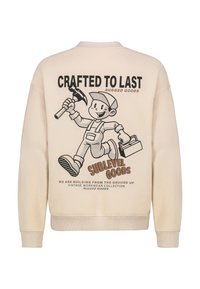 Cremefarbener Sweatshirt mit einem grafischen Aufdruck auf der Rückseite, der eine Comicfigur zeigt, die einen Hammer und einen Werkzeugkasten hält, sowie Text, der robuste Waren beschreibt.