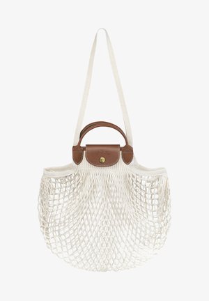 White netted bag with a brown leather base and handle. Includes a tan flap closure with a gold button. Sturdy woven straps for carrying.