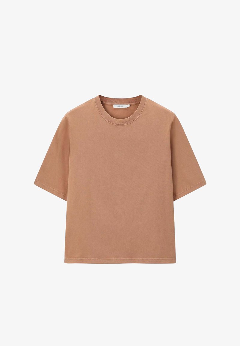 T-shirt à manches courtes et coupe ample en marron clair. Fabriqué en coton, il présente un col rond et une texture lisse. Pas de motifs ni d'accents.