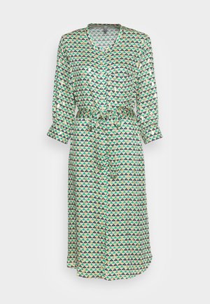 Long, button-up dress made of fabric with a geometric triangle pattern in green, blue, and beige. Includes a waist tie and cuffed sleeves.