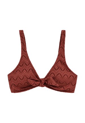 Haut court en couleur rouille foncée avec motif en dentelle en zigzag et détail noué au centre devant, doté de larges bretelles.