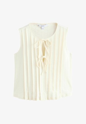 Top crem cu mâneci scurte, cu plisaje verticale, decolteu rotund și un detaliu cu fundă în față. Fabricat dintr-un material ușor.