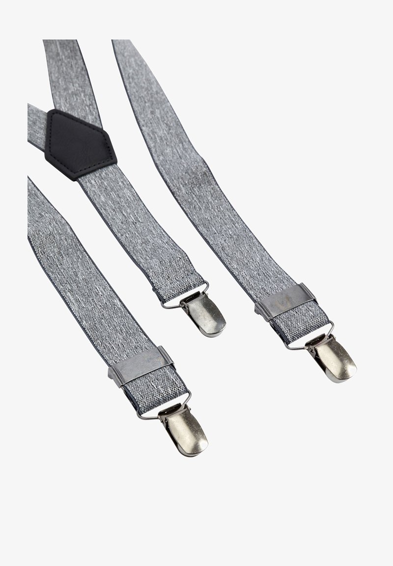 Hallgrisest kangast rihmad metallklambritega, millel on keskne must nahast aksent ja tekstureeritud viimistlus, et tagada parem haardevõime ja tugi.