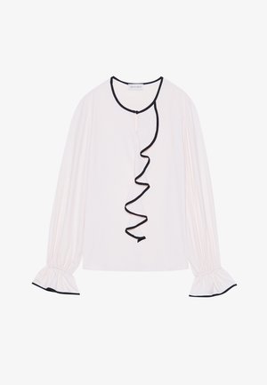 Langärmlige Bluse aus hellrosa Stoff, mit rüschengemeißelten schwarzen Abschlüssen entlang der Vorderseite und der Manschetten sowie elastischen Details.