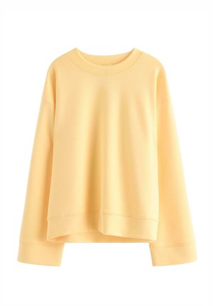 Enkelt lysegul langærmet sweatshirt med rund hals og ribstrikkede manchetter og kant, vist på en hvid baggrund.