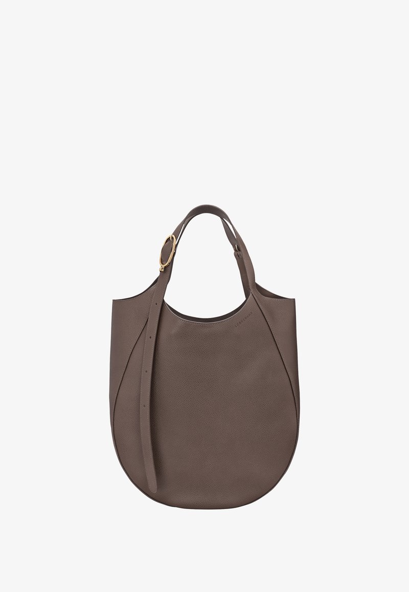 Brown textured leather shoulder bag with a curved shape, adjustable strap, and gold buckle detail on a white background.