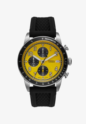 Fossil Chronograph-Uhr mit gelbem Ziffernblatt, drei schwarzen Subdials, großen schwarz-weißen Stundenmarkierungen, schwarzem Gummiarmband und Verzierungen aus rostfreiem Stahl.
