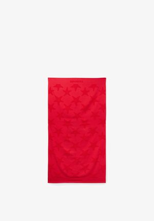 Tissu rectangulaire rouge avec motifs d'étoiles en relief et logo "TEZENIS" en haut au centre, posé à plat sur un fond blanc.
