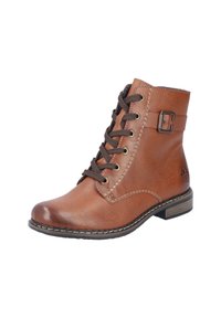 Bottine en cuir brun avec lacets bruns, détail de boucle sur le côté et accents cousus. Présente une pointe arrondie et un talon bas empilé.