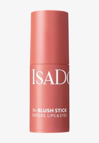 Blush stick in een cilindrische houder, matte perzikkleur, met witte tekst met de woorden "ISADORA" en "The BLUSH STICK", voor wangen, lippen en ogen.