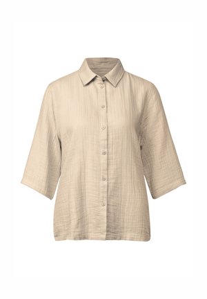 Camicia beige dal taglio morbido in tessuto stropicciato. Presenta un colletto a punte, chiusura con bottoni e maniche a tre quarti.