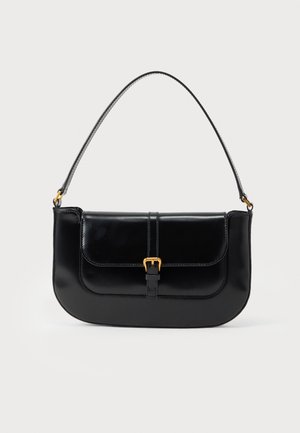 Black leather shoulder bag with front flap, gold buckle detail, and single thin strap against a plain light background.