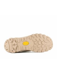 Tan rubber outsole with deep treads and a Vibram logo. Features rugged patterns for traction and stability on various surfaces.