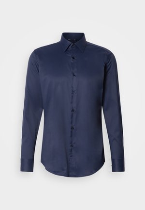 Navy blue long-sleeve men's dress shirt with pointed collar and front button closure, displayed on plain white background.