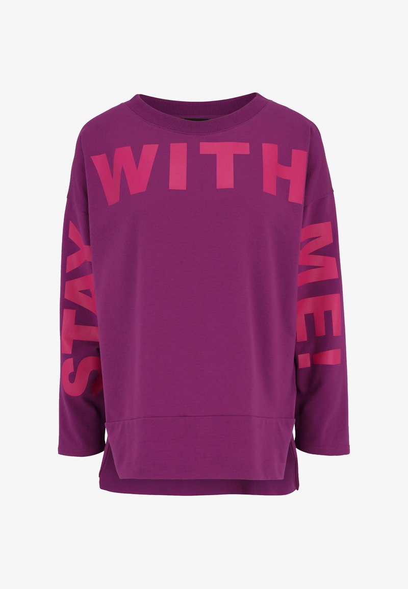 Purple long-sleeve sweatshirt featuring large pink text "STAY WITH ME!" on the front and right sleeve. Soft fabric with a relaxed fit.