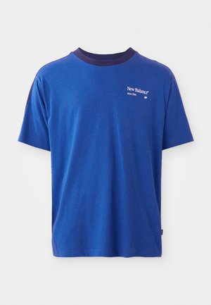Blue cotton t-shirt with a navy ribbed crew neckline, featuring a small white New Balance logo on the left chest. Short sleeves, classic fit.