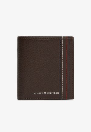 Brown textured leather wallet with vertical red, white, and blue stitching and "Tommy Hilfiger" logo in silver at bottom left.