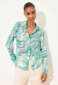 Unselected, mint green zebra print