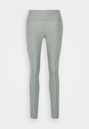 Light gray, fitted leggings with a smooth, textured surface and a high, elastic waistband. No visible seams or patterns.
