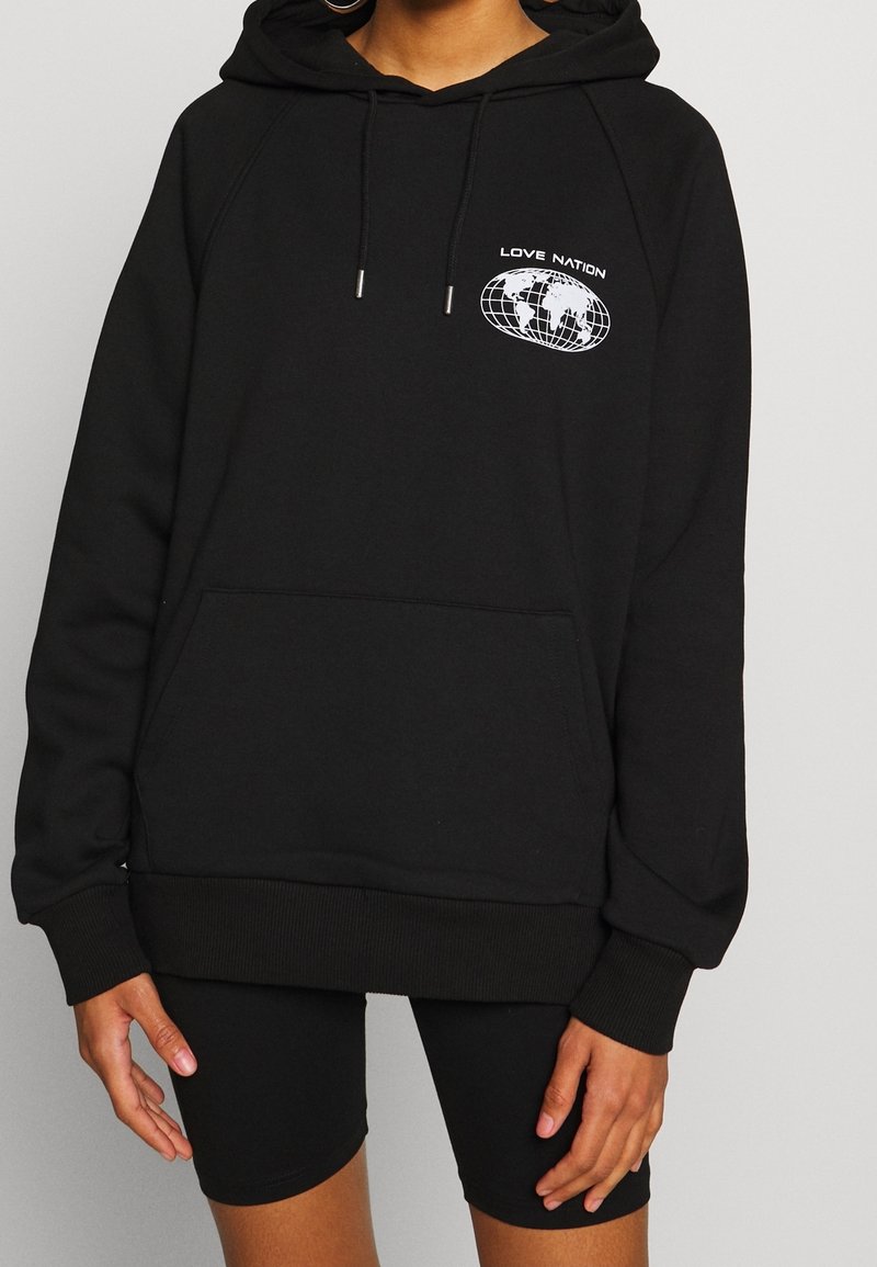 Black hoodie made of soft fabric, featuring a kangaroo pocket, ribbed cuffs and hem, and white "LOVE NATION" logo with globe graphic.