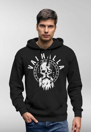 Black hoodie with front pocket, features a white skull graphic and "VALHALLA" text. Made of soft fabric, relaxed fit, and drawstring hood.