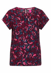 Kortärmad blus i mörkblått tyg med paisley- och blommönster i rosa, rött och blått, med en nyckelhålsdetalj på baksidan.