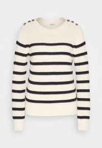 Pull en maille crème avec des rayures horizontales noires, col rond, manches longues, poignets et ourlet côtelés, et boutons décoratifs sur les coutures des épaules.