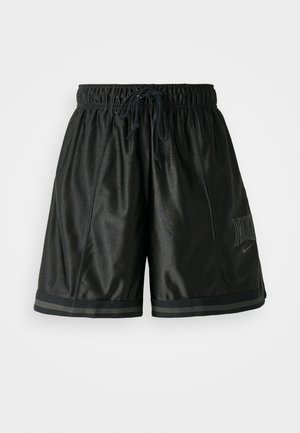 Melnas sporta bikses ar elastīgu jostasvietu, auklu un plakanu šuvēm. Satur toņu Nike logo un kontrastējošus svītrojumus.