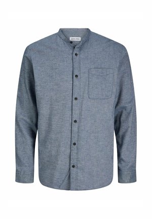 Sininen chambray-paita, jossa on pystykalvo, etupainike, pitkät hihat ja yksi rintatasku. Teksturoitu kangas.