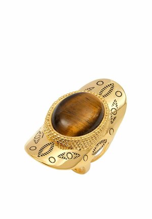 Bague en or avec une pierre ovale en œil de tigre, ornée d'accents en perles et de motifs de feuilles gravés sur un large band.