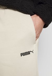 Puma CLASSICS  FL - Tepláky - peyote