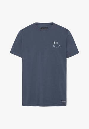 T-shirt en coton bleu marine à manches courtes, présentant un graphisme de smiley blanc et un détail de texte au bas. Design classique à col rond.