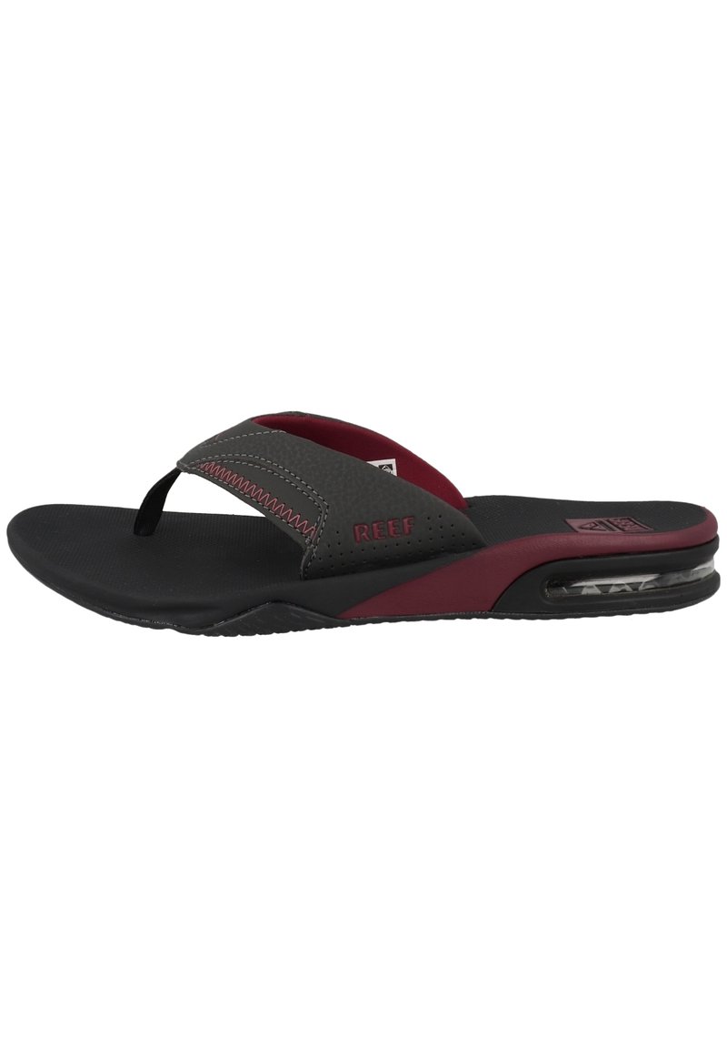Black and burgundy flip-flops with a cushioned sole, textured straps, and a clear air cushion detail on the heel for added comfort.