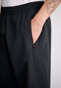 adidas Originals Calças de fato de treino - black