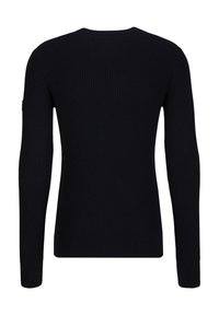 Zwart geribd longsleeve trui met een ronde halslijn en aansluitende boorden. Soepele textuur met subtiele stikdetails op de rug.