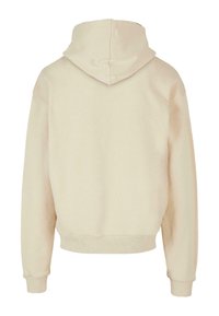 Beige színű kapucnis pulóver kenguruzsebbel, bordázott mandzsettákkal és bélelt kapucnival, puha anyagból, sima felülettel.