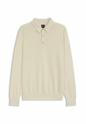 Jasnokremowa, długorękawowa koszulka polo z teksturowanej tkaniny, z kołnierzykiem i trzema guzikami z przodu. Żebrowane mankiety na rękawach.