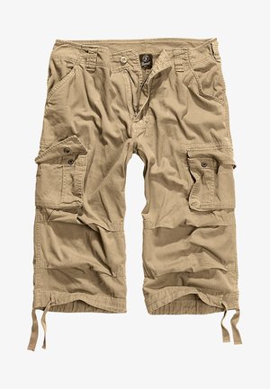 Beige cargo shorts valmistettu puuvillasekoitteesta. Ominaisuuksina useita taskuja, napsulukko ja säädettävät narut helmassa.