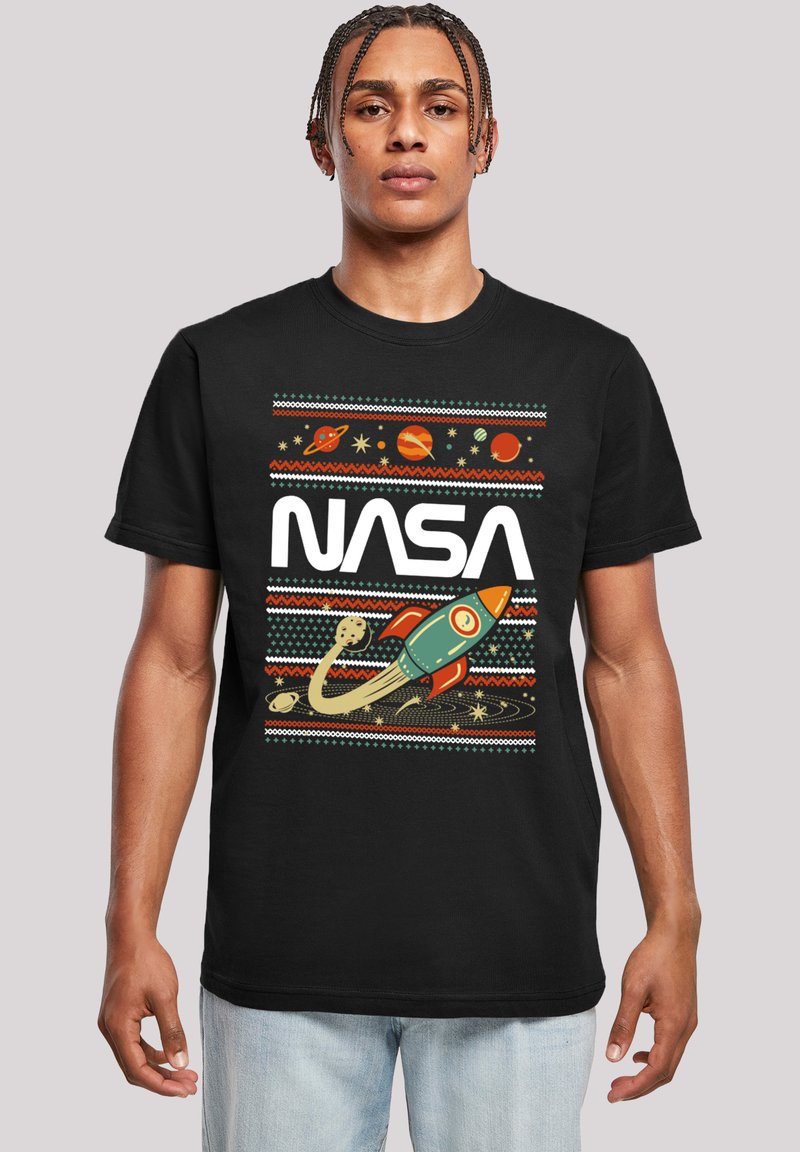 Black cotton T-shirt featuring a colorful NASA graphic with planets, stars, and a rocket, set against a patterned design.