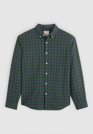 Chemise à manches longues à boutons avec un motif écossais vert, bleu et jaune, boutons blancs et col à boutons.