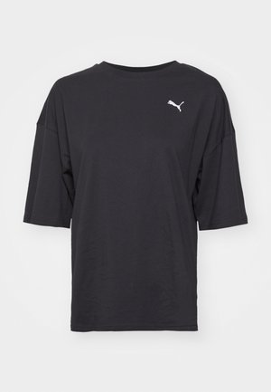 Black oversized t-shirt made of cotton, featuring short sleeves and a round neckline, with a white Puma logo on the left chest.