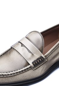 Light grey leather loafer with a rounded toe, metal accent strap, and contrasting stitching details along the edge and on the sides.