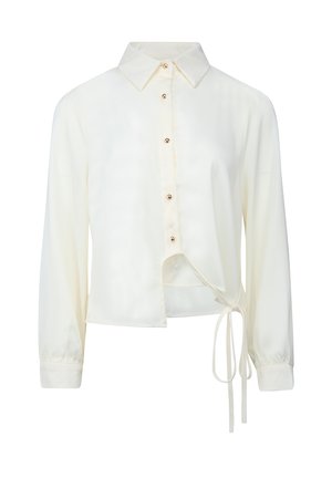 Camicia bianca a maniche lunghe con bottoni, colletto e orlo asimmetrico legato su un lato con lunghi lacci.