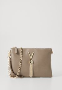 Brown leather crossbody bag with chain strap, featuring a gold V-shaped logo and a tassel accent. Smooth texture and zip closure.