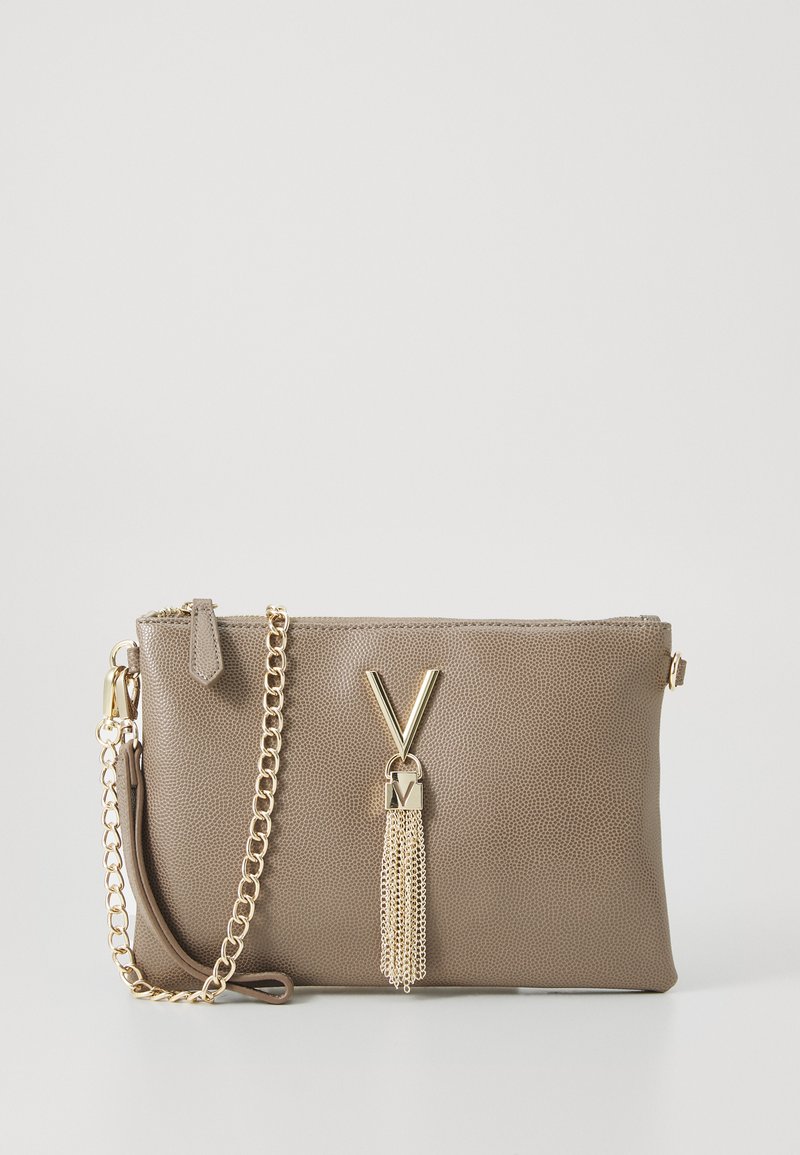 Brown leather crossbody bag with chain strap, featuring a gold V-shaped logo and a tassel accent. Smooth texture and zip closure.