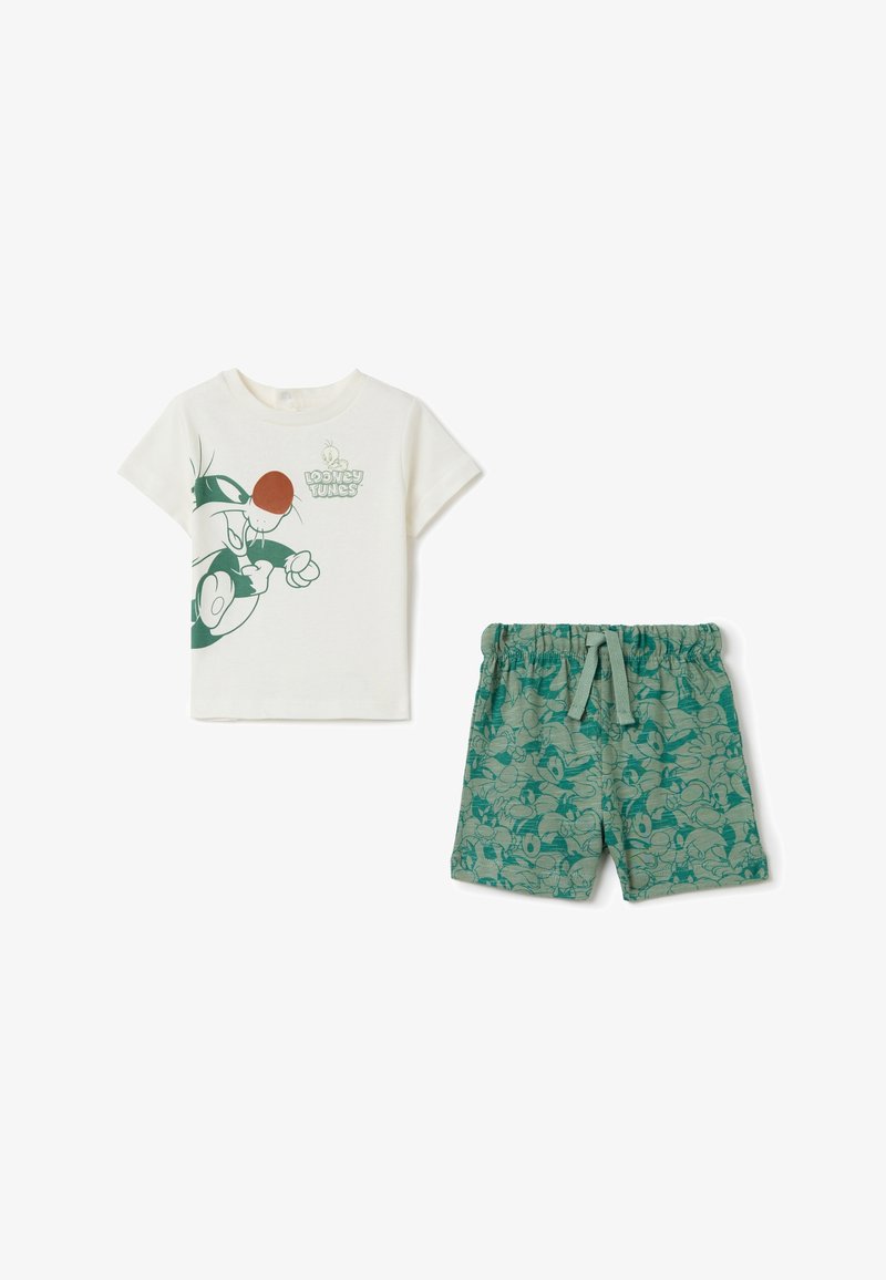Cremefarbendes Baumwoll-T-Shirt mit grünem Looney Tunes Druck; passende grüne Shorts mit Cartoon-Muster und elastischem Bund.